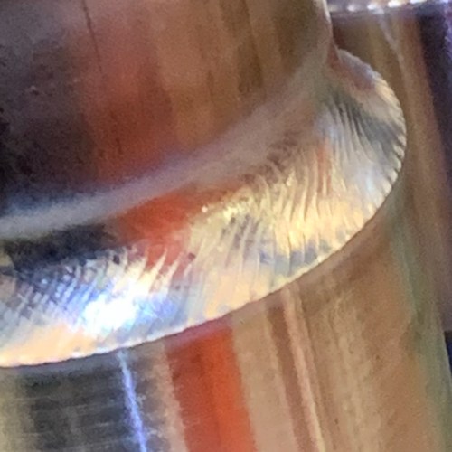 Close-up of an orbital tube weld